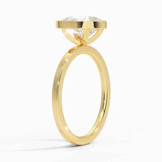 1.50 Ct Pear Cut Moissanite Bezel Set Engagement Ring in Yellow Gold