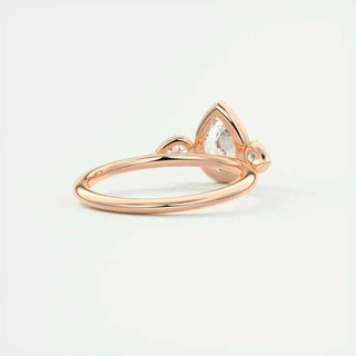2 Carat Pear Cut Three Stone Bezel Set Moissanite Ring in Rose Gold
