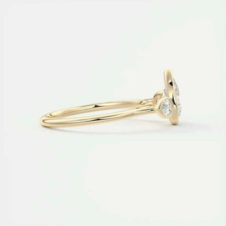 2 Carat Pear Cut Three Stone Bezel Set Moissanite Ring in Rose Gold
