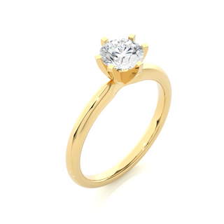 Angled view of 1.50 Carat Round Cut Moissanite Solitaire Engagement Ring In Yellow Gold, showcasing the band and setting.
