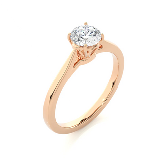 Angled view of 0.75 Carat Round Moissanite Solitaire Engagement Ring in Rose Gold, showcasing the band and setting.​