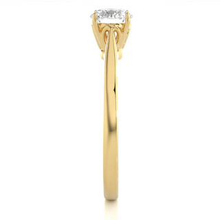 Side profile of 0.75 Carat Round Moissanite Solitaire Engagement Ring in Yellow Gold, highlighting the prong setting.