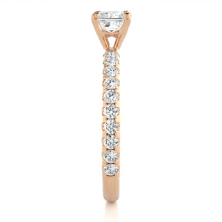 Side profile of1.50 Ct Princess Cut Moissanite Engagement Ring with Accents in Rose Gold, highlighting the prong setting.