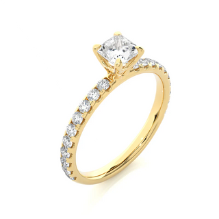 Angled view of 1.50 Ct Princess Cut Moissanite Engagement Ring with Accents in Yellow Gold, showcasing the band and setting.​