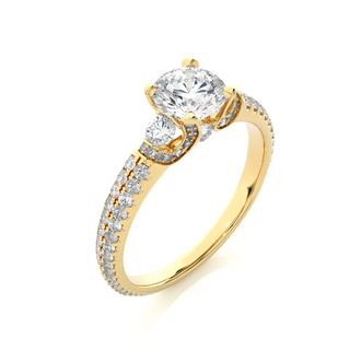 Angled view of 1 Carat Round Moissanite Engagement Ring With Accents in Yellow Gold, showcasing the band and setting.​