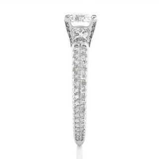 Side profile of 1 Carat Round Cut Moissanite Engagement Ring With Accents in Silver, highlighting the prong setting.