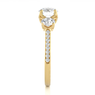Side profile of 2.50 Carat Round Moissanite Three Stone Engagement Ring in Yellow Gold, highlighting the prong setting.