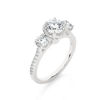 Angled view of 2.50 Carat Round Moissanite Three Stone Engagement Ring in Silver, showcasing the band and setting.​
