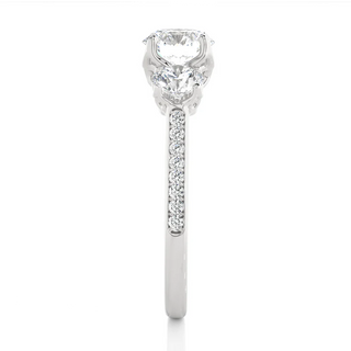 Side profile of 2.50 Carat Round Moissanite Three Stone Engagement Ring in Silver, highlighting the prong setting.