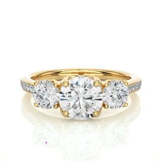 Front view of 2.50 Carat Round Moissanite Three Stone Engagement Ring in Yellow Gold, highlighting the brilliant center moissanite stone.