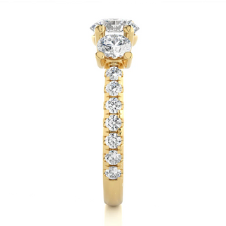 Side profile of 2.50 Ct Round Moissanite Trellis Prong Three Stone Engagement Ring Yellow Gold, highlighting the prong setting.