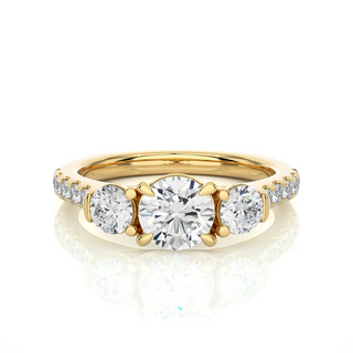 Front view of 2 Carat Round Moissanite Engagement Three Stone Ring In Yellow Gold, highlighting the brilliant center moissanite stone.