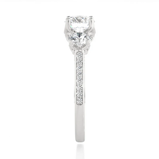 Side profile of 2 Carat Round Moissanite Filigree Three Stone Engagement Ring in White Gold, highlighting the prong setting.
