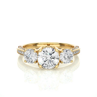 Front view of 2 Carat Round Moissanite Filigree Three Stone Engagement Ring in Yellow Gold, highlighting the brilliant center moissanite stone.