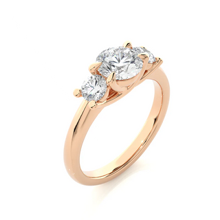 Angled view of 2 Carat Round Moissanite Three Stone Engagement Ring in Rose Gold, showcasing the band and setting.​