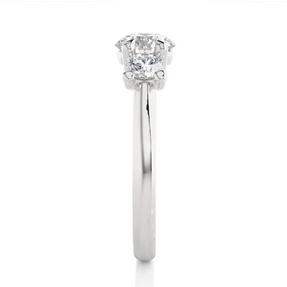 Side profile of 2 Carat Round Moissanite Three Stone Engagement Ring In White Gold, highlighting the prong setting.