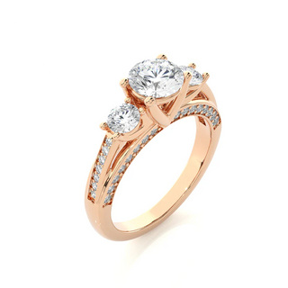 Angled view of 2 Carat Moissanite Three Stone Engagement Ring With Accents in Rose Gold, showcasing the band and setting.​