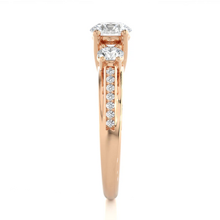 Side profile of 2 Carat Moissanite Three Stone Engagement Ring With Accents in Rose Gold, highlighting the prong setting.