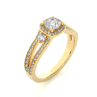 Angled view of 2 Carat Cushion Cut Moissanite Three Stone Halo Ring In Yellow Gold, showcasing the band and setting.​
