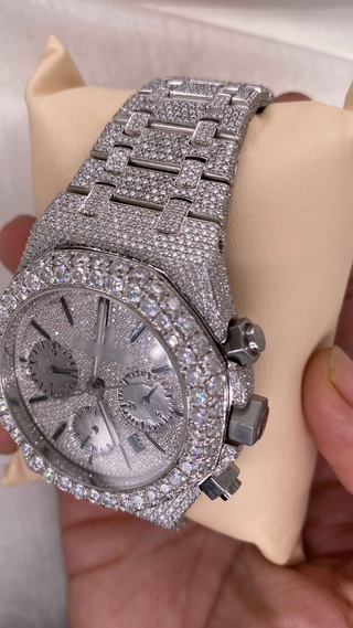 Side view of AP-style iced out moissanite watch for men with pavé diamond dial, bezel, chronograph subdials, and silver bracelet.