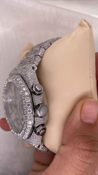 Side view of AP-style iced out moissanite watch for men with pavé diamond dial, bezel, chronograph subdials, and silver bracelet.
