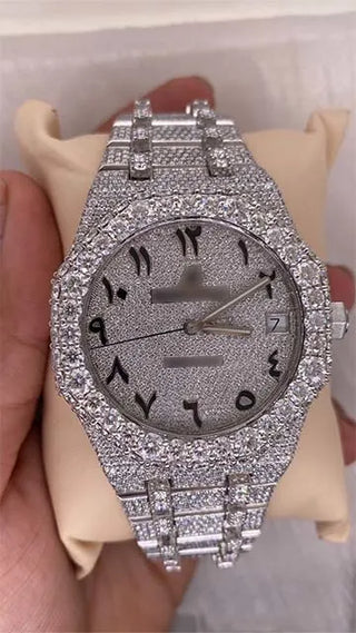 Cheap moissanite replica watch with full stone dial, Arabic numerals, date window, and fully studded case and strap.




























