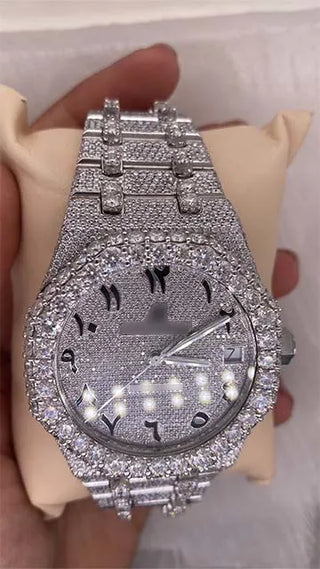 Side view of a moissanite replica watch showing the stone-studded bezel, case thickness, and crown with Arabic numeral dial.