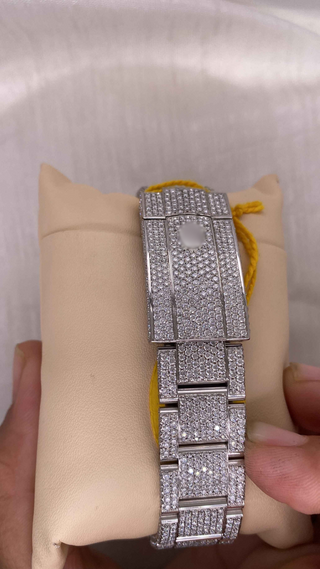 Back view of iced out moissanite watch bracelet featuring fully encrusted silver links with micro-pavé diamond detailing.