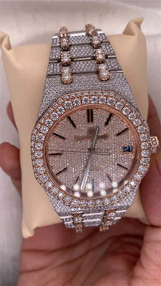 Iced out AP Moissanite Watch with rose gold details, moissanite-studded dial, date display, and stainless steel strap.
