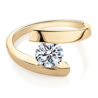 Tension Set Round Cut Moissanite Solitaire Engagement Ring In Yellow Gold