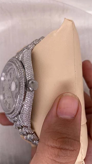 Side view of one of the best moissanite watches with a white gold crown, Moissanite-studded bezel, and stainless steel strap.