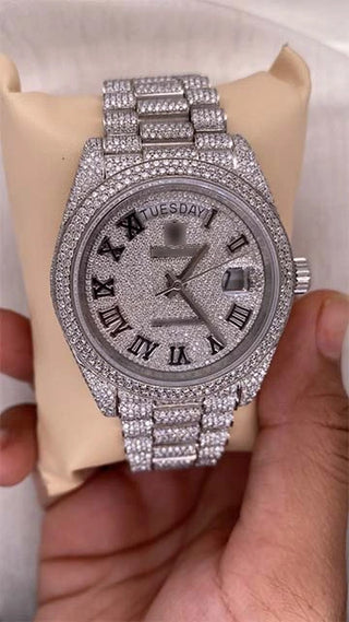 Front view of the best moissanite watch with moissanite-studded dial, rose gold accents, and stainless steel strap.