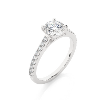 Angled view of 1.20 Ct Round Cut Moissanite Cathedral Set Engagement Ring In Silver, showcasing the band and setting.​