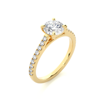 Angled view of 1.20 Ct Round Cut Moissanite Cathedral Set Engagement Ring In Yellow Gold, showcasing the band and setting.​
