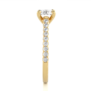 Side profile of 1.20 Ct Round Cut Moissanite Cathedral Set Engagement Ring In Yellow Gold, highlighting the brilliant center moissanite stone., highlighting the prong setting.