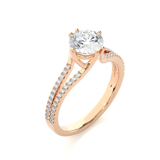 Angled view of 1.40 Ct Round Cut Moissanite Split Shank Engagement Ring In Rose Gold, showcasing the band and setting.​