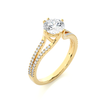 Angled view of 1.40 Ct Round Cut Moissanite Split Shank Engagement Ring In Yellow Gold, showcasing the band and setting.​