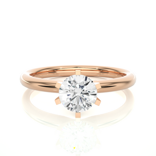 Front view of 1.50 Carat Round Cut Moissanite Solitaire Engagement Ring In Rose Gold, highlighting the brilliant center moissanite stone.