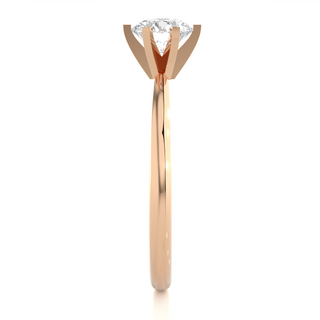 Side profile of 1.50 Carat Round Cut Moissanite Solitaire Engagement Ring In Rose Gold, highlighting the prong setting.