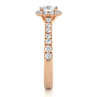 Side profile of 1.50 Carat Round Moissanite Halo Engagement Ring In Rose Gold, highlighting the brilliant center moissanite stone., highlighting the prong setting.