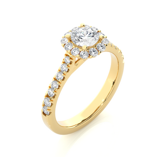 Angled view of 1.50 Carat Round Moissanite Halo Engagement Ring In Yellow Gold, showcasing the band and setting.​