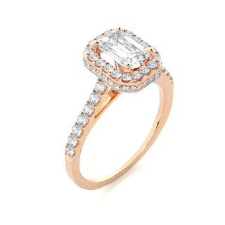 Angled view of 1.50 Ct Emerald Cut Moissanite Halo Engagement Ring In Rose Gold, showcasing the band and setting.​