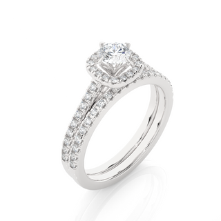 Angled view of 1.50 Ct Halo Moissanite Bridal Set With Accents in White Gold, showcasing the band and setting.​