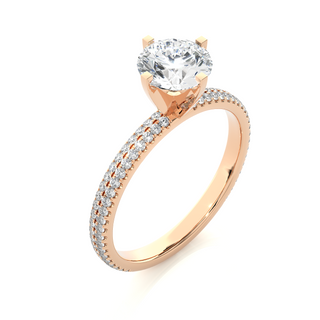 Angled view of 1.50 Ct Moissanite Engagement Ring With Accents In Rose Gold, showcasing the band and setting.​
