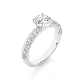 Angled view of 1.50 Ct Moissanite Engagement Ring With Three Row Accents In White Gold, showcasing the band and setting.​
