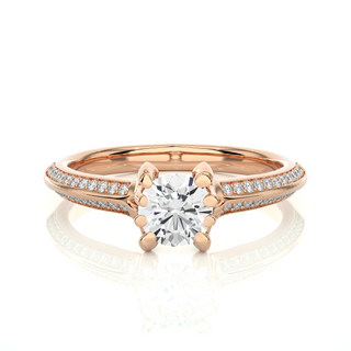 Front view of 1.50 Ct Round Cut Moissanite Two Row Accent Engagement Ring In Rose Gold, highlighting the brilliant center moissanite stone.