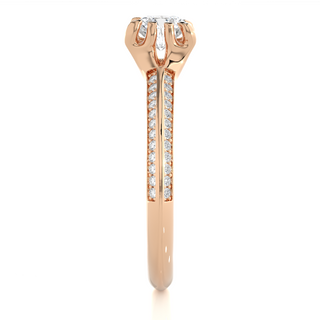 Side profile of 1.50 Ct Round Cut Moissanite Two Row Accent Engagement Ring In Rose Gold, highlighting the prong setting.