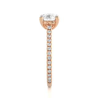 Side profile of 1.50 Ct Round Moissanite Hidden Halo Engagement Ring In Rose Gold, highlighting the brilliant center moissanite stone., highlighting the prong setting.