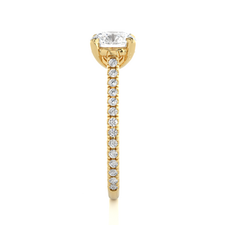 Side profile of 1.50 Ct Round Moissanite Hidden Halo Engagement Ring In Yellow Gold, highlighting the brilliant center moissanite stone., highlighting the prong setting.