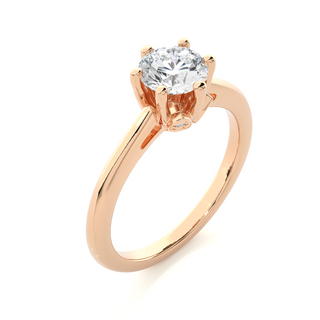 Angled view of 1.50 Ct Round Moissanite Solitaire Engagement Ring In Rose Gold, showcasing the band and setting.​